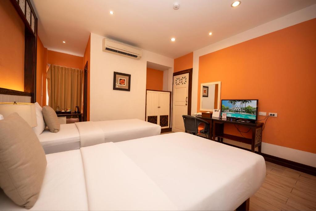 Le Charme Sukhothai Historical Park byder på charmerende boutiqueværelser omgivet af lotusdamme og tropiske haver. 