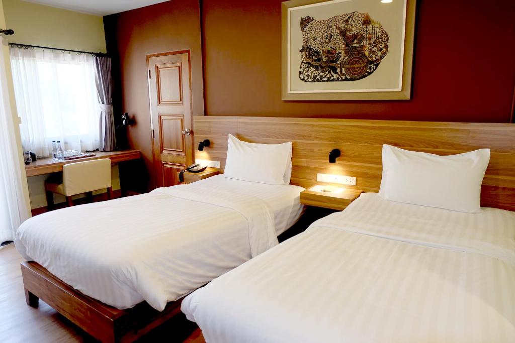 Siri Oriental Bangkok Hotel forener traditionel thailandsk stil og moderne komfort. 